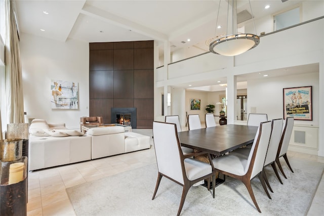 80 Valentines Ln, Old Brookville, NY 11545 - dining space with a towering ceiling, a fireplace, light tile patterned flooring, and recessed lighting