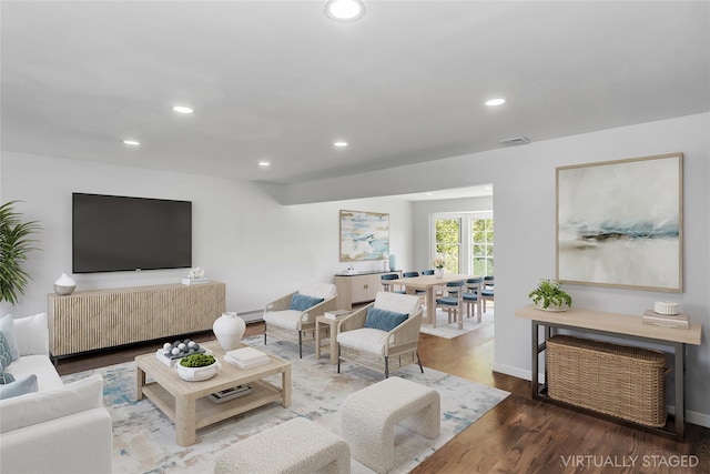 1402 Bay Blvd, Atlantic Beach, NY 11509 - living room featuring recessed lighting, wood finished floors, and a baseboard heating unit