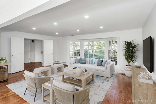 1402 Bay Blvd, Atlantic Beach, NY 11509 - living area with a baseboard radiator, wood finished floors, and recessed lighting