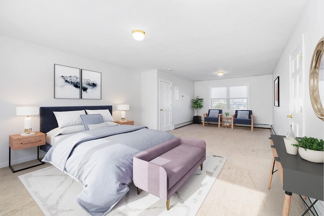 bedroom featuring baseboards, baseboard heating, and light carpet