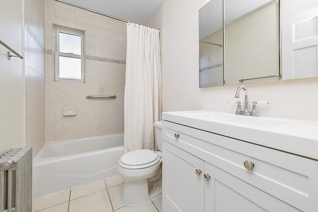 full bathroom featuring tile patterned floors, vanity, toilet, shower / tub combo with curtain, and radiator