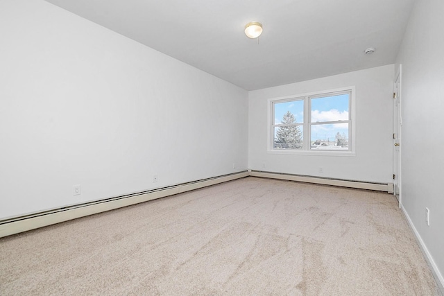 carpeted spare room with baseboards
