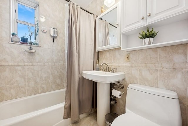 bathroom featuring shower / bath combination with curtain and toilet