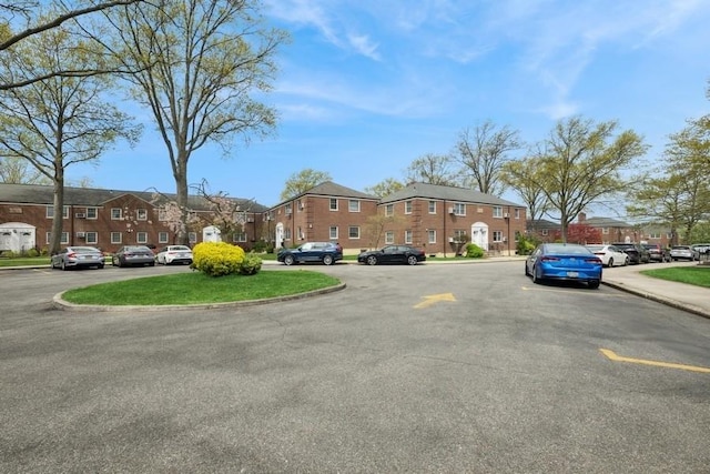 view of street with a residential view and curbs
