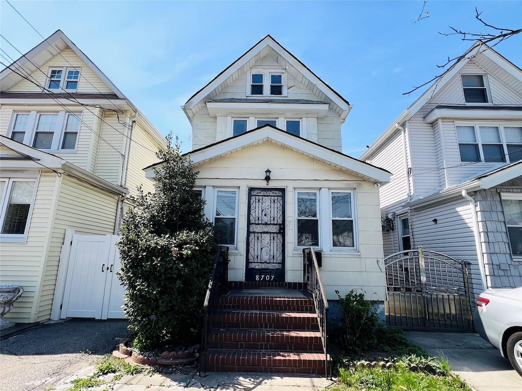 8707 Eliot Ave, Rego Park, NY 11374 - view of front of property featuring fence and a gate
