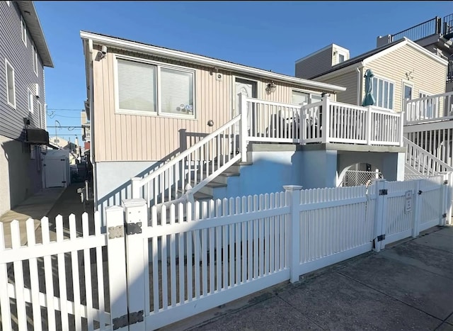 30 Delaware Ave, Long Beach, NY 11561 - exterior space featuring a gate, stairs, and a fenced front yard
