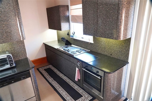 3 Beech Court Cir, College Point, NY 11356 - kitchen featuring dark countertops, appliances with stainless steel finishes, and tasteful backsplash