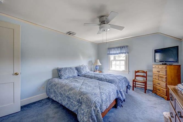 carpeted bedroom featuring baseboards, ceiling fan, vaulted ceiling, and visible vents