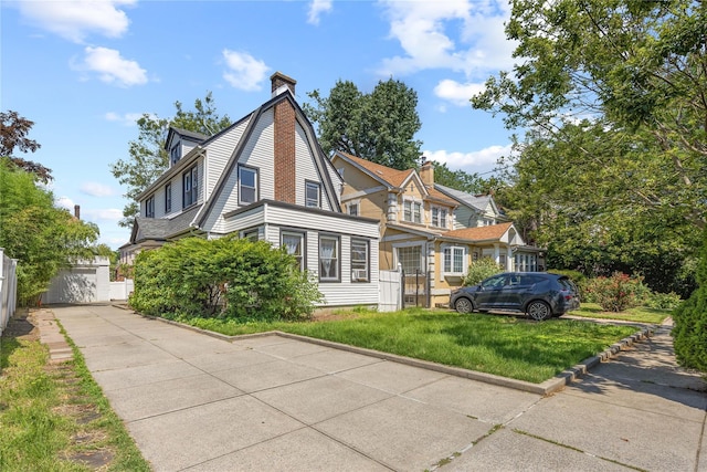 47-18 163rd St, Flushing, NY 11358 - view of front of home with a chimney