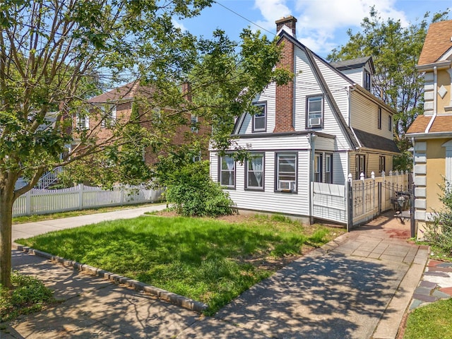 47-18 163rd St, Flushing, NY 11358 - view of front of property with a chimney and cooling unit