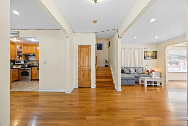47-18 163rd St, Flushing, NY 11358 - entryway with light wood-style flooring, recessed lighting, and arched walkways