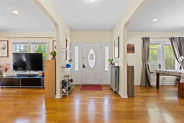 47-18 163rd St, Flushing, NY 11358 - entryway featuring arched walkways, wood finished floors, crown molding, and recessed lighting