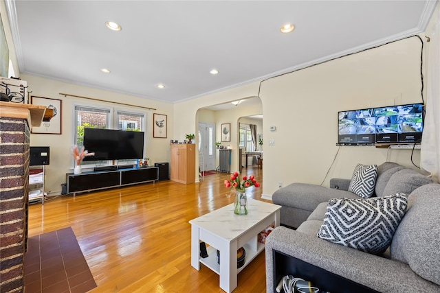 47-18 163rd St, Flushing, NY 11358 - living area with arched walkways, ornamental molding, light wood finished floors, and recessed lighting