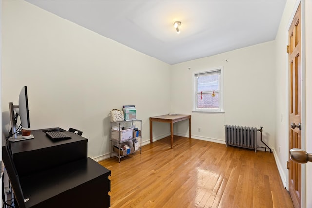 47-18 163rd St, Flushing, NY 11358 - misc room with radiator heating unit, light wood finished floors, and a desk