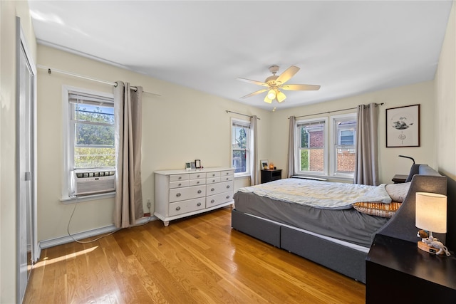 47-18 163rd St, Flushing, NY 11358 - bedroom with multiple windows, light wood-style floors, cooling unit, and ceiling fan