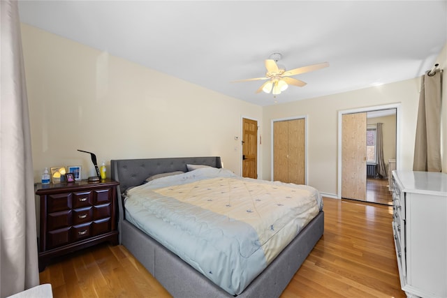 47-18 163rd St, Flushing, NY 11358 - bedroom featuring light wood-style flooring, two closets, and ceiling fan