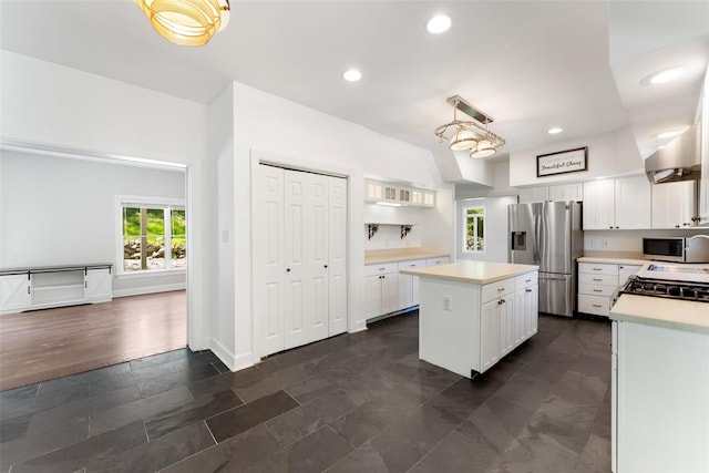kitchen with a healthy amount of sunlight, light countertops, and stainless steel appliances