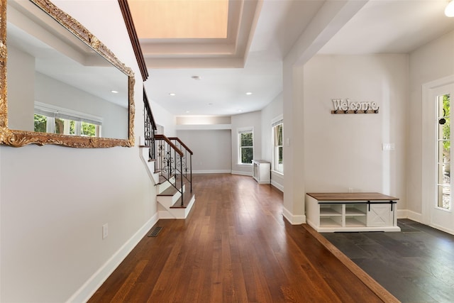foyer with wood-type flooring, recessed lighting, baseboards, visible vents, and stairway