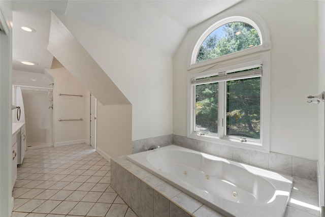 full bathroom with vanity, lofted ceiling, a shower, a tub with jets, and tile patterned floors