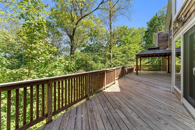wooden deck featuring a gazebo