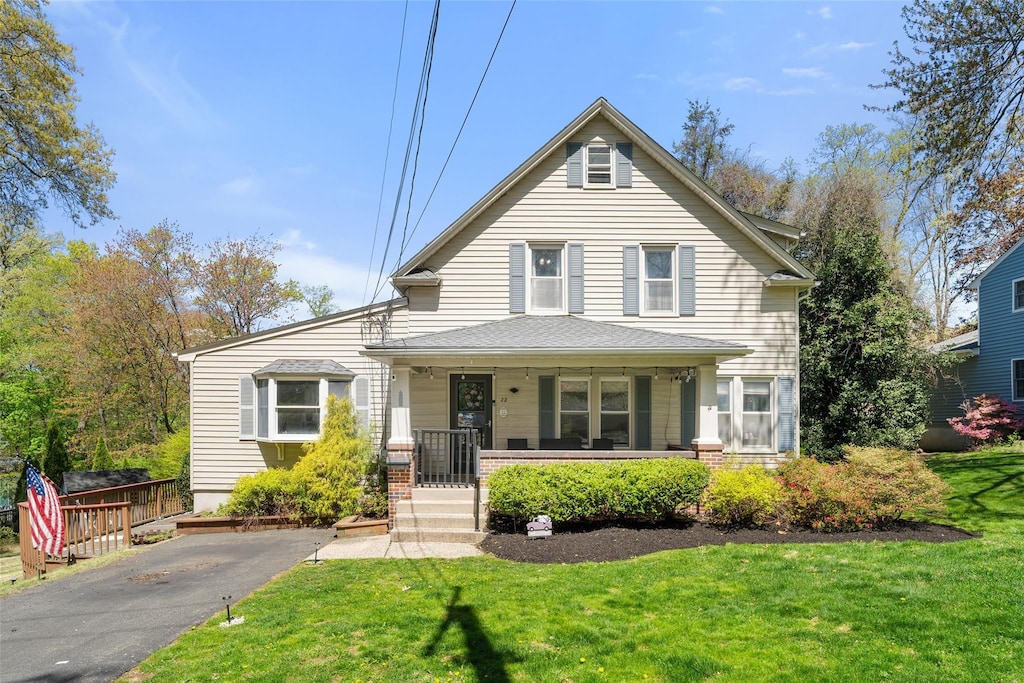 22 Blauvelt St, Nanuet, NY 10954 - view of front of property with covered porch and a front yard