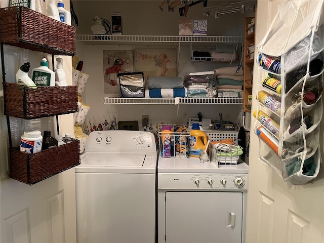 washroom featuring washer and dryer and laundry area
