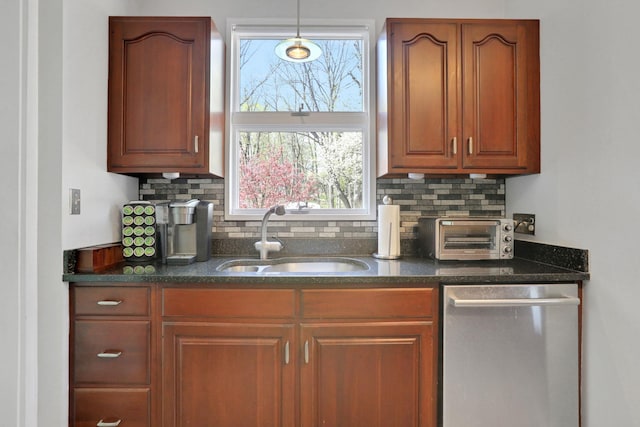 kitchen featuring a sink, stainless steel dishwasher, backsplash, and a toaster