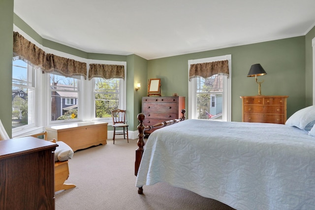 carpeted bedroom with baseboards