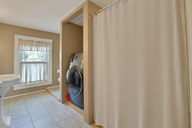 washroom with light tile patterned floors and washer / clothes dryer