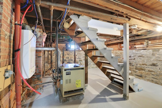 unfinished basement featuring stairway