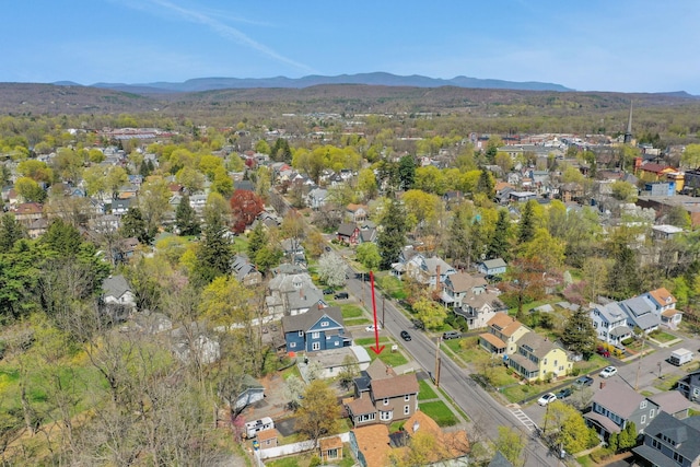 drone / aerial view featuring a residential view and a mountain view