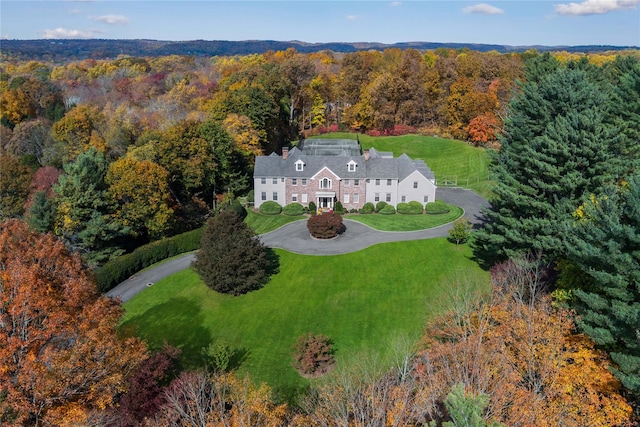 aerial view featuring a wooded view