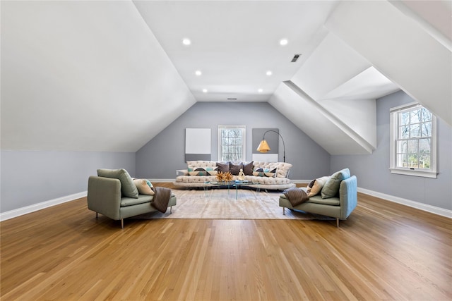 sitting room with a wealth of natural light, light wood-style floors, and visible vents