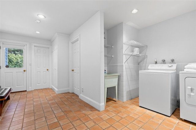 washroom with light tile patterned floors, laundry area, recessed lighting, and independent washer and dryer
