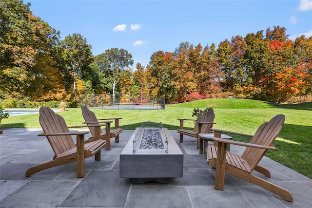 view of patio / terrace featuring an outdoor fire pit