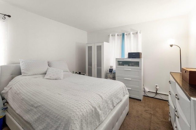 carpeted bedroom with a baseboard heating unit