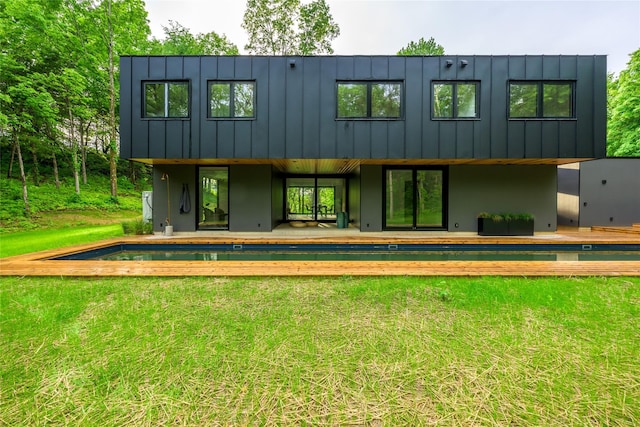 474 Rte 199, Red Hook, NY 12571 - back of house with a lawn, an outdoor pool, and board and batten siding