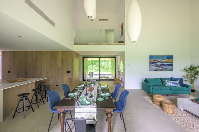 474 Rte 199, Red Hook, NY 12571 - tiled dining area featuring wooden walls and a high ceiling