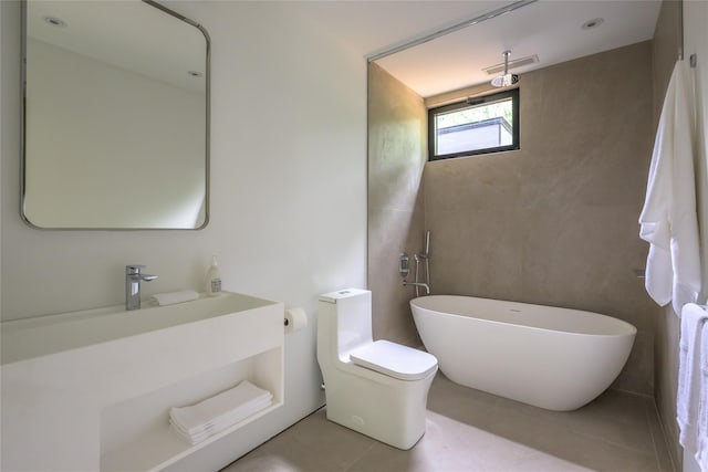 474 Rte 199, Red Hook, NY 12571 - bathroom featuring a freestanding bath, tile patterned floors, vanity, and toilet