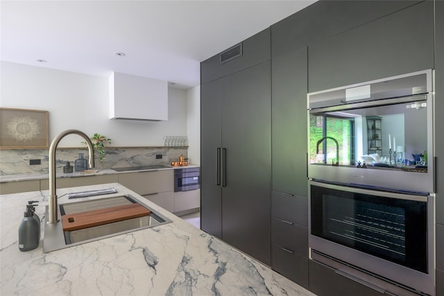 474 Rte 199, Red Hook, NY 12571 - kitchen with double oven, modern cabinets, light stone countertops, and a sink