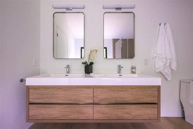 474 Rte 199, Red Hook, NY 12571 - bathroom with double vanity, toilet, and wood finished floors