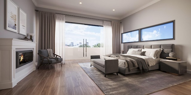 bedroom featuring crown molding, a glass covered fireplace, wood finished floors, and access to outside