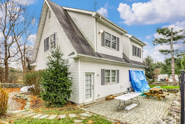 121 Thiells Rd, Stony Point, NY 10980 - rear view of house with a patio and a shingled roof