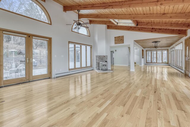 121 Thiells Rd, Stony Point, NY 10980 - unfurnished living room with ceiling fan, baseboard heating, wooden ceiling, beamed ceiling, and light wood-style flooring