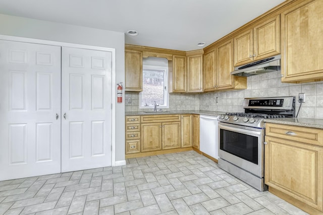 121 Thiells Rd, Stony Point, NY 10980 - kitchen with stainless steel range with gas cooktop, a sink, decorative backsplash, and under cabinet range hood