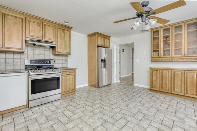 121 Thiells Rd, Stony Point, NY 10980 - kitchen with stainless steel appliances, baseboards, a ceiling fan, backsplash, and under cabinet range hood