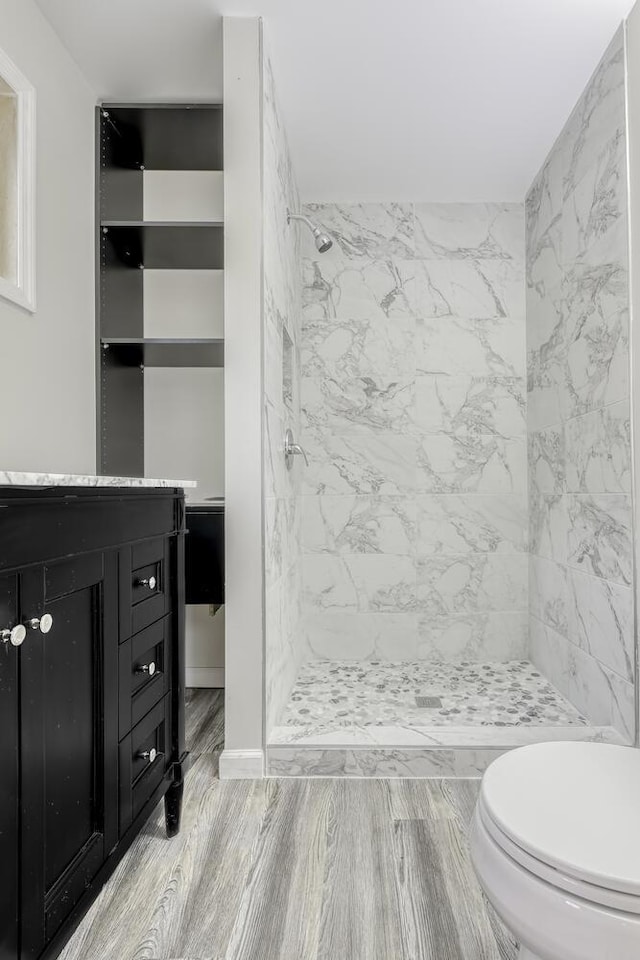 121 Thiells Rd, Stony Point, NY 10980 - bathroom featuring vanity, wood finished floors, toilet, and a shower stall