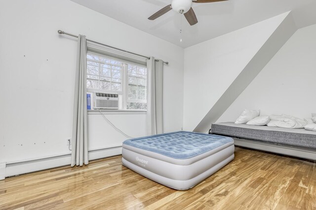121 Thiells Rd, Stony Point, NY 10980 - bedroom with cooling unit, a ceiling fan, and light wood finished floors