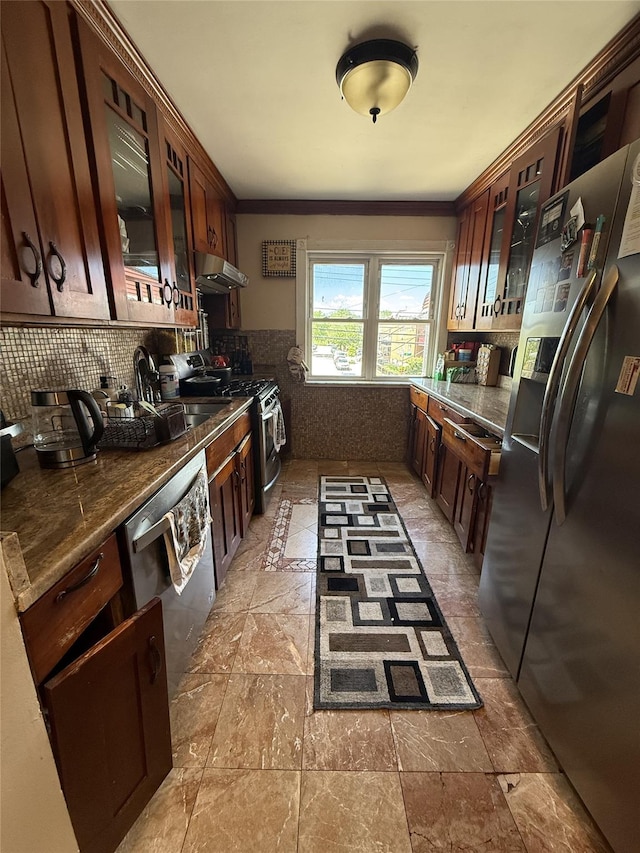 62-23 69th Pl, Middle Village, NY 11379 - kitchen featuring stainless steel appliances, glass insert cabinets, tasteful backsplash, under cabinet range hood, and light stone finish flooring