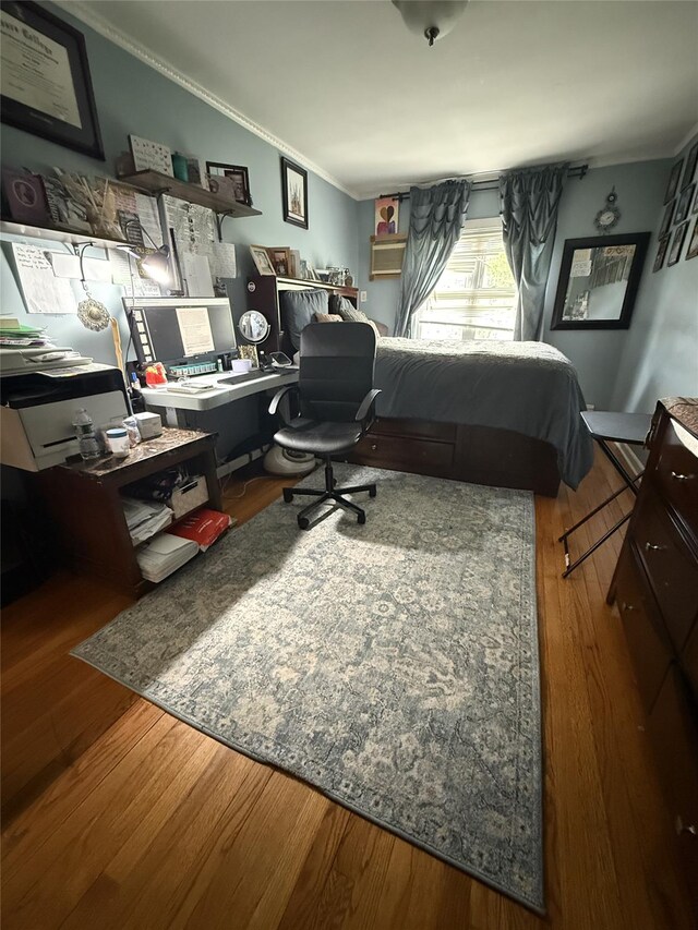 62-23 69th Pl, Middle Village, NY 11379 - bedroom featuring ornamental molding, wood finished floors, and a desk
